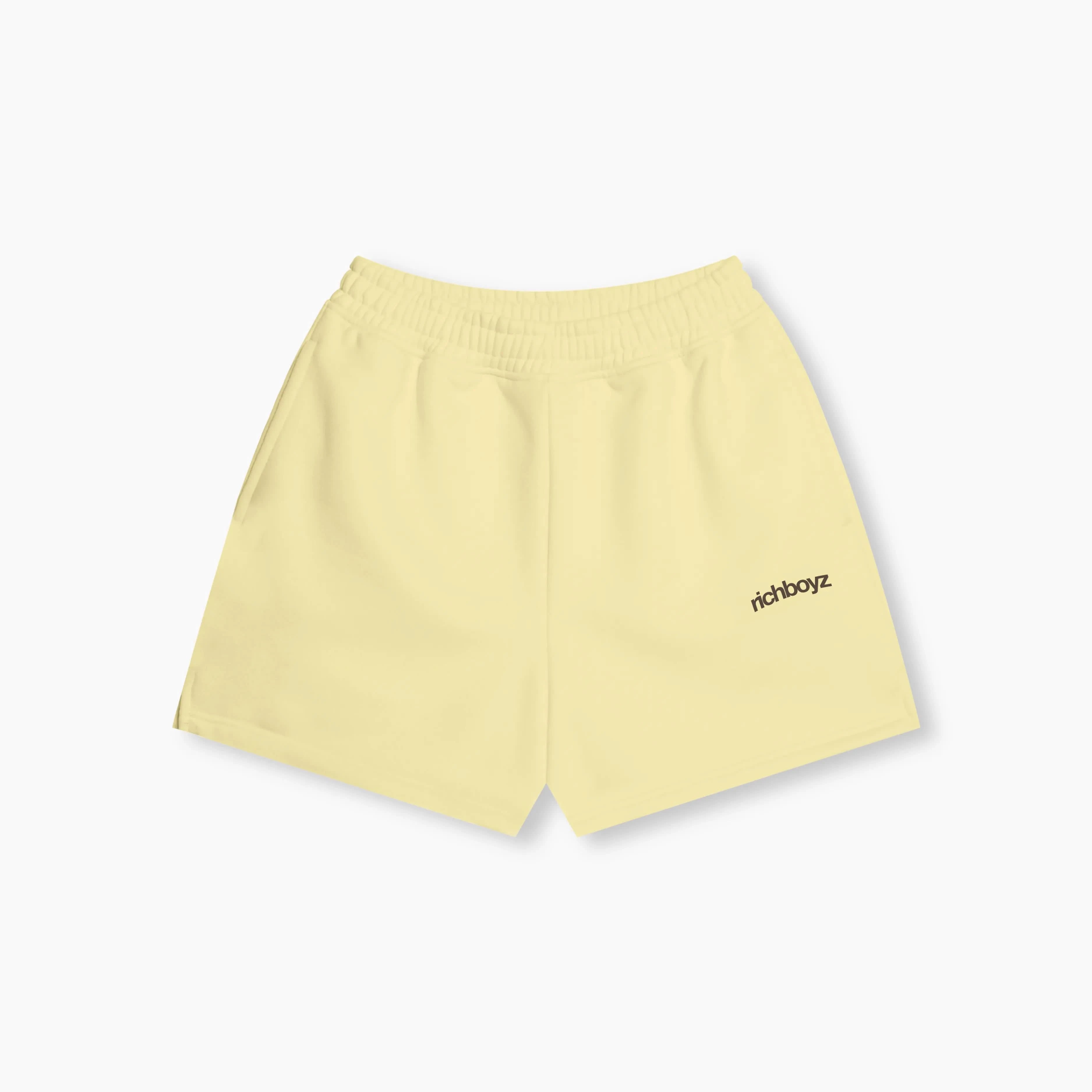 Yellow shorts with 'richboyz' branding on a white background