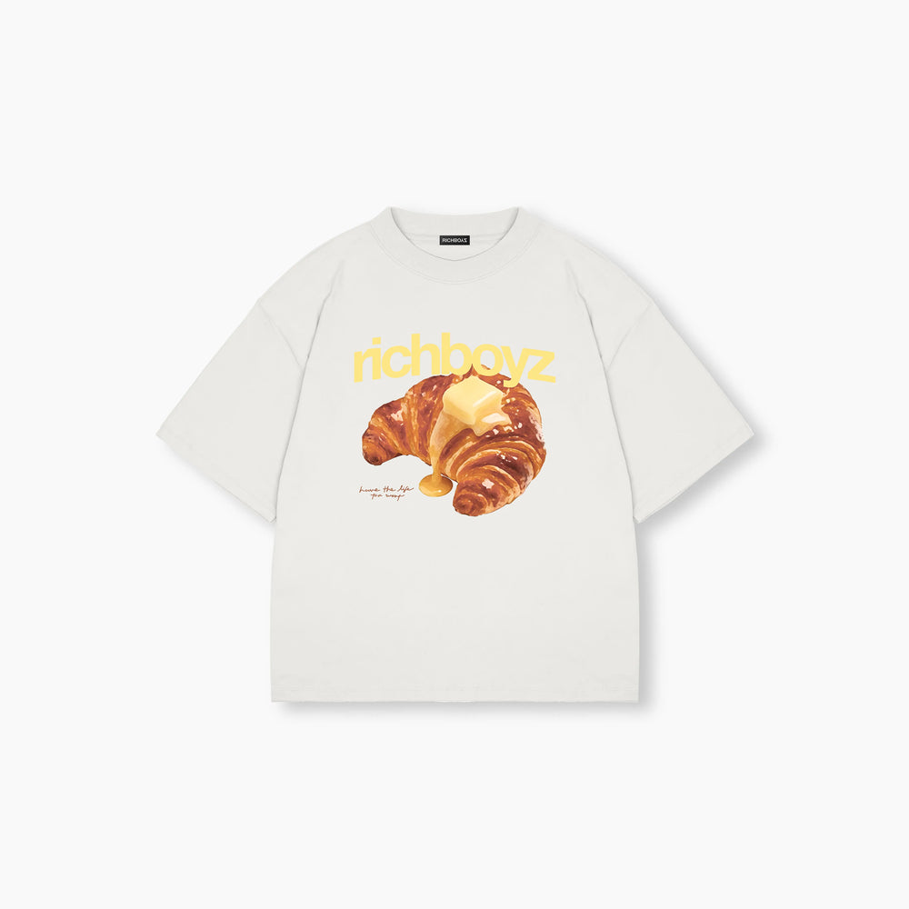 White t-shirt with a croissant graphic and 'richboyz' text on a white background