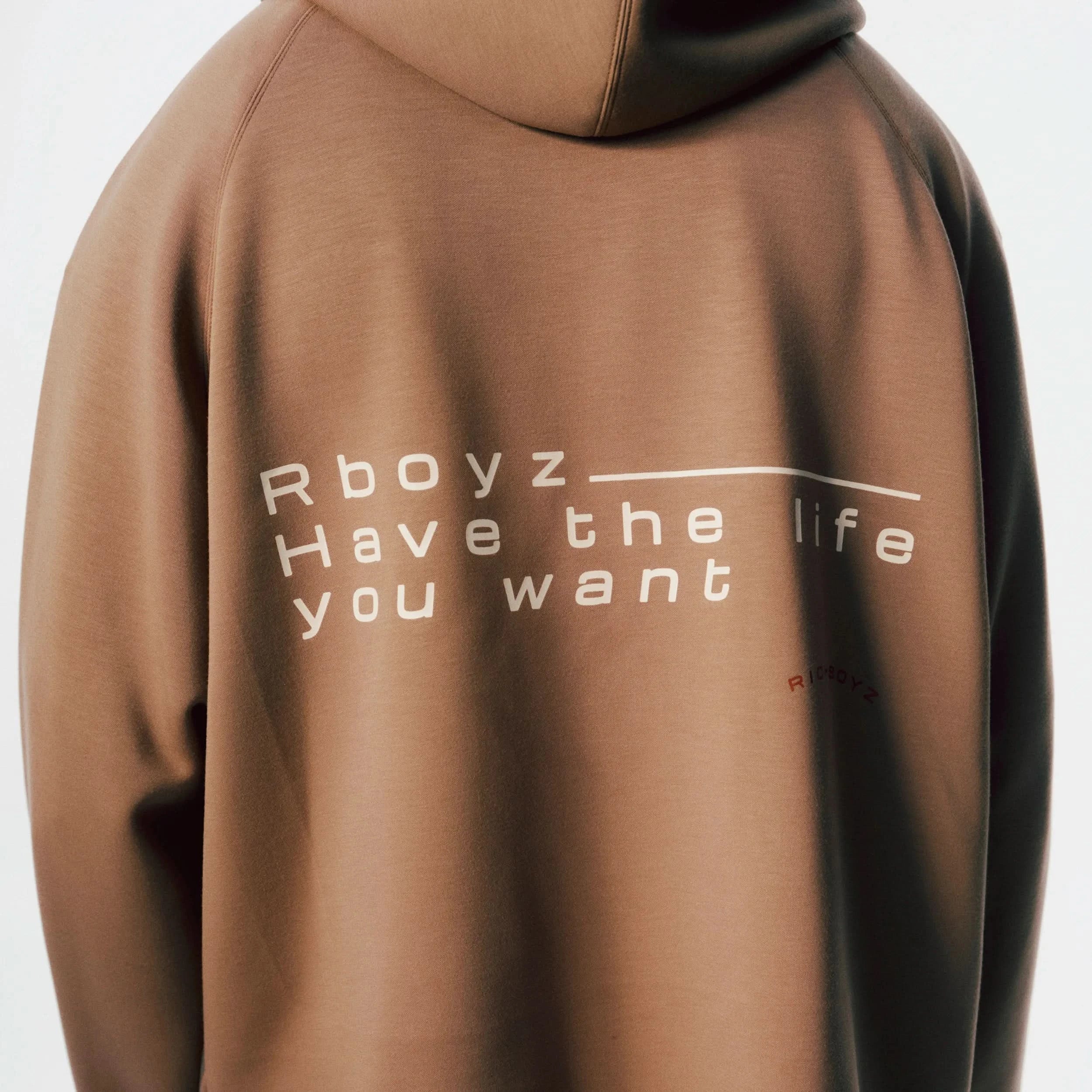 Close-up of Airy Quarter Zip Hoodie soft fabric texture and quarter-zip detail in Khaki