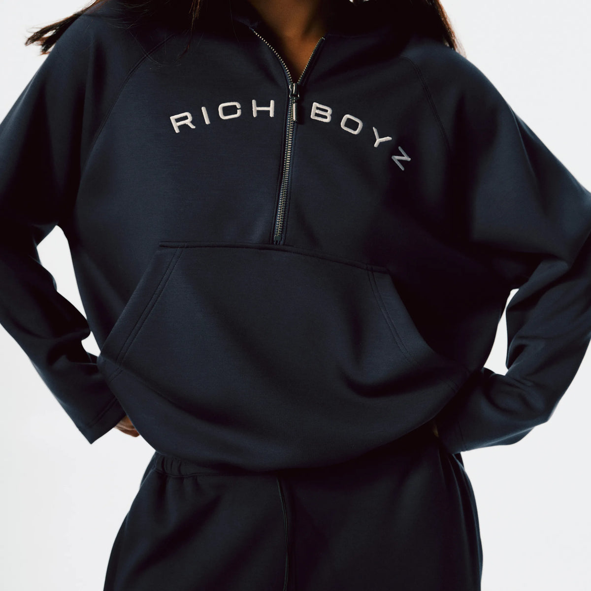 Close-up of Airy Quarter Zip Hoodie soft fabric texture and quarter-zip detail in Navy Blue