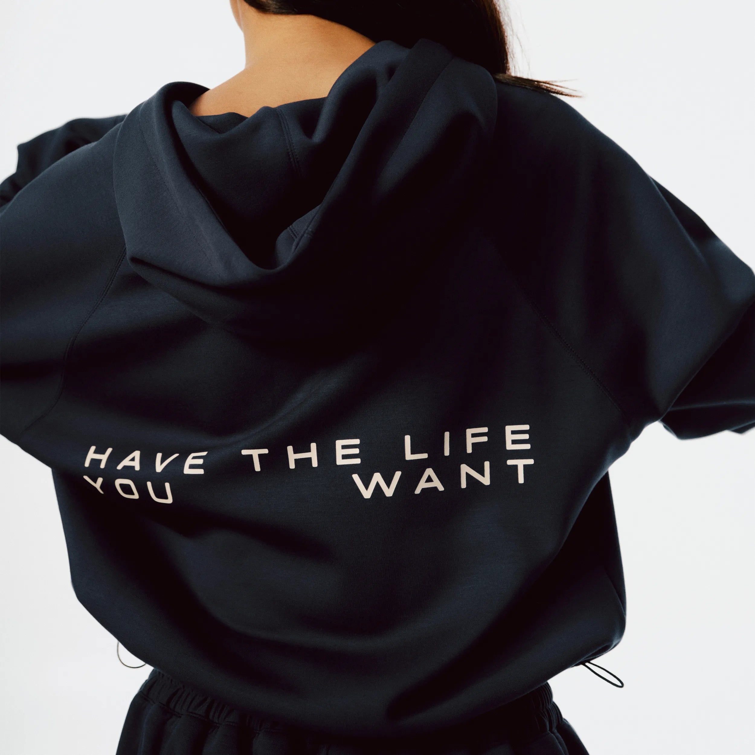 Close-up of Airy Quarter Zip Hoodie soft fabric texture and quarter-zip detail in Navy Blue